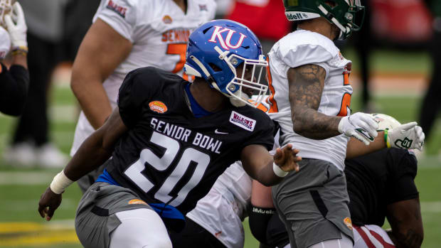 Feb 1, 2022; Mobile, AL, USA; National linebacker Kyron Johnson of Kansas (20) pursues a play during National practice for the 2022 Senior Bowl at Hancock Whitney Stadium. Mandatory Credit: Vasha Hunt-USA TODAY Sports
